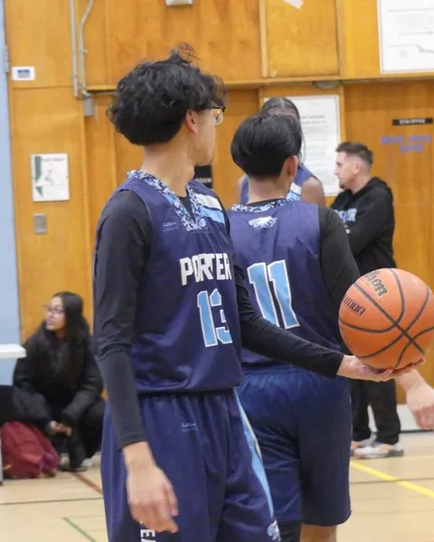 Ahnaf in a Porter #13 jersey holding a basketball