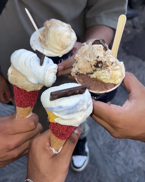 Four gelatos held up together by friends