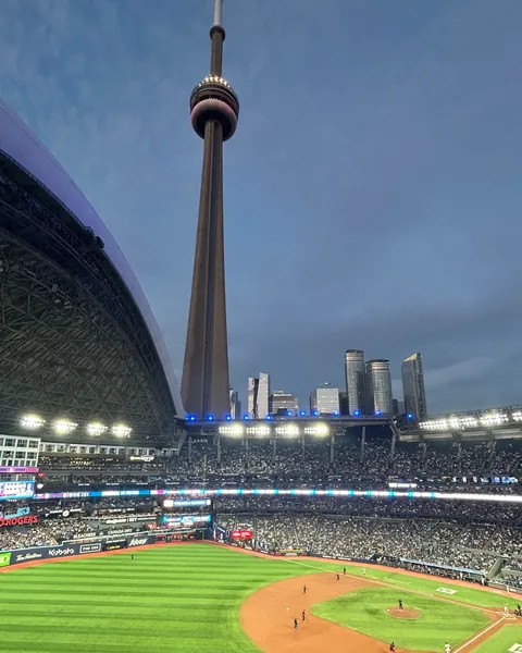 A Blue Jays game at Rogers Centre with the CN Tower above